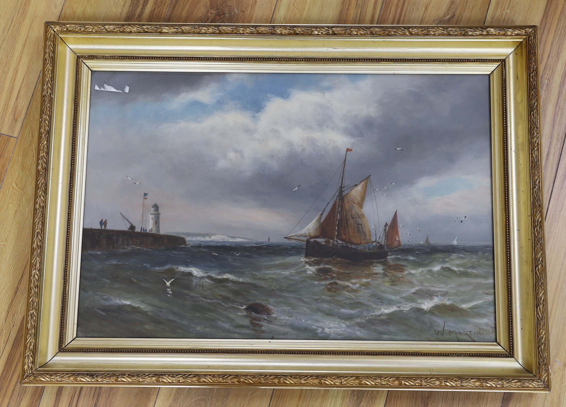 W. Martin c.1900, oil on canvas, Fishing boat entering harbour, signed, 40 x 60cm